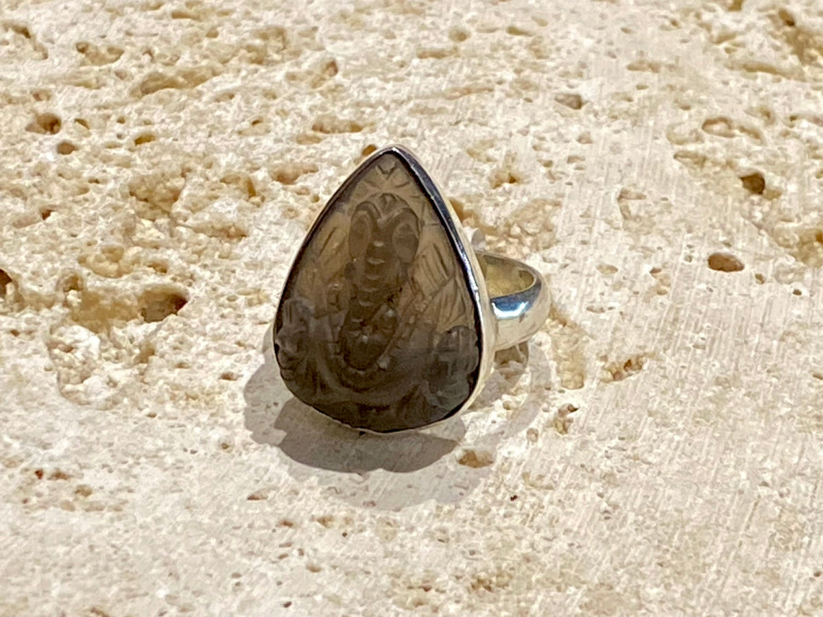Hand carved smokey quartz ring featuring an image of Ganesh, set in sterling silver. Stone length 2.1 cm, width 1.6 cm, US Size 7 | Inside diameter 17.5 mm