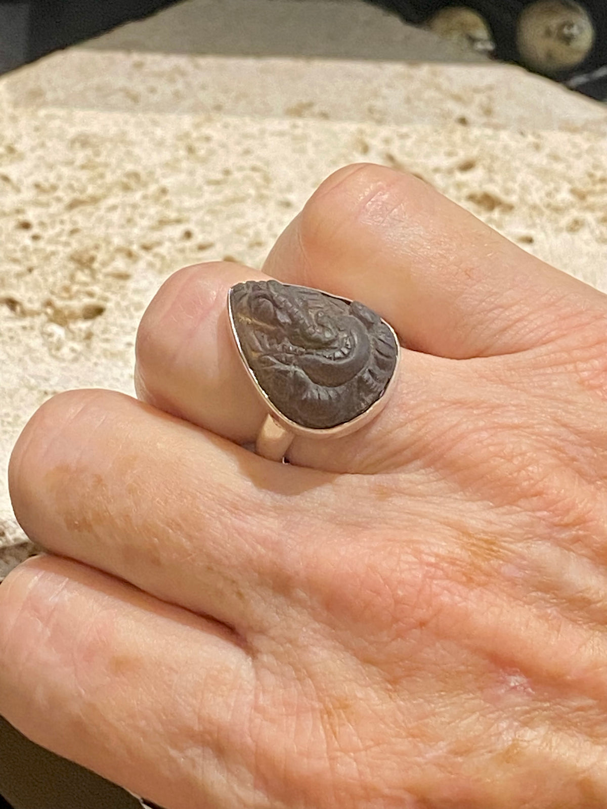 Hand carved smokey quartz ring featuring an image of Ganesh, set in sterling silver. Stone length 2.1 cm, width 1.6 cm, US Size 7 | Inside diameter 17.5 mm