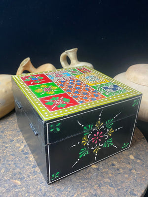 Vibrant hand painted trinket box. Small brass knob as handle. Perfect little boxes to keep your trinkets in. Great box to hold your essential oils or jewellery. From Rajasthan, India. Measurements: 15 x 15 cm, height 10.5 cm