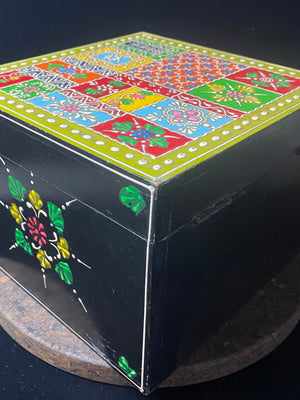 Large and vibrant hand painted trinket box. Small brass knob as handle. Perfect decorated box to keep your trinkets in. Its large roomy interior makes this a great box to hold essential oils or jewellery.  From Rajasthan, India.  Measurements: 20 x 20 cm, height 16 cm
