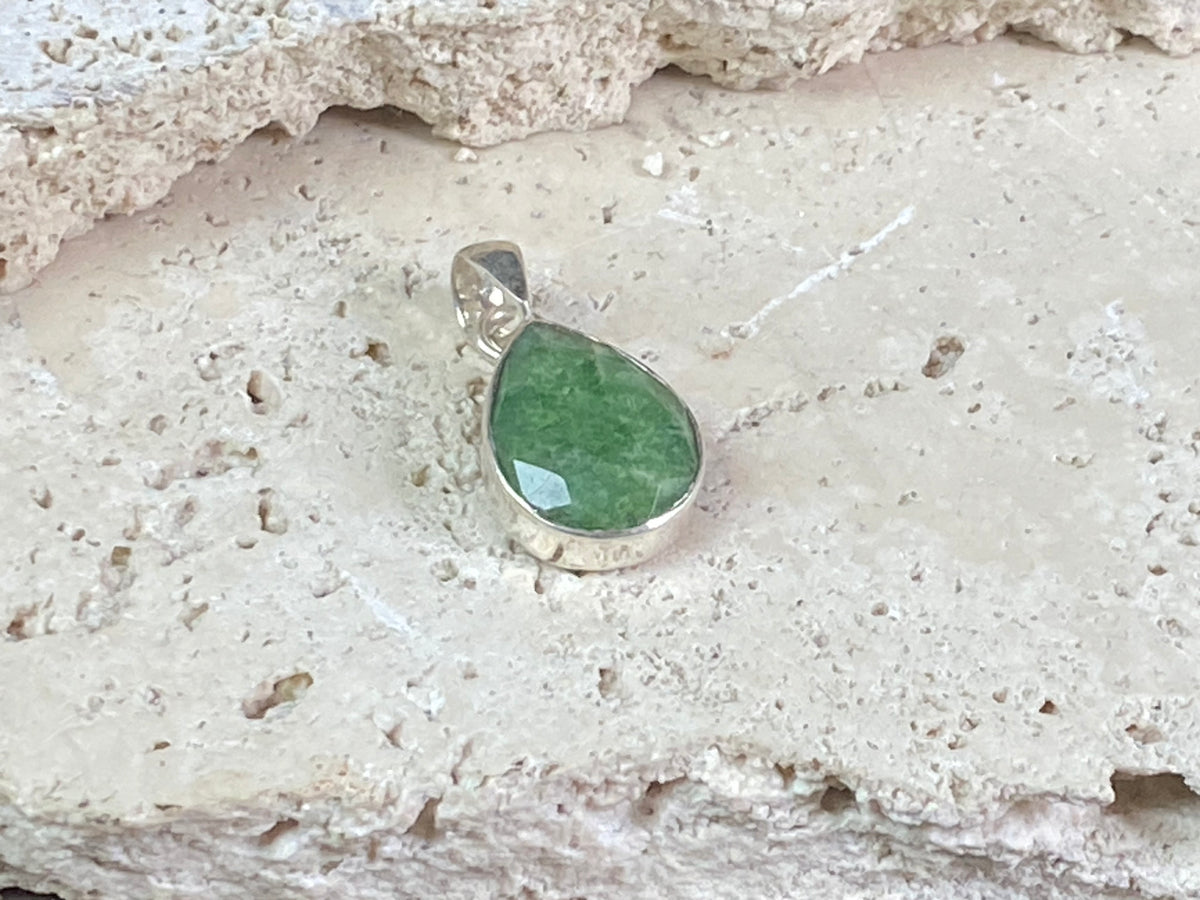 Six lush natural emerald pendants featuring large facet cut stones set in sterling silver. All are set with generous bails to fit on even the largest of chains, torcs or cords. Ranging in length from 6 cm to 2.8 cm