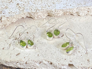 Beautiful peridot earrings featuring gem quality facet cut peridot stones in three shapes, teardrop, oval or leaf. A sterling silver mount and hook completes the look. These earrings are open at the back to allow light to shine through the stones. Around 3 cm length including hook