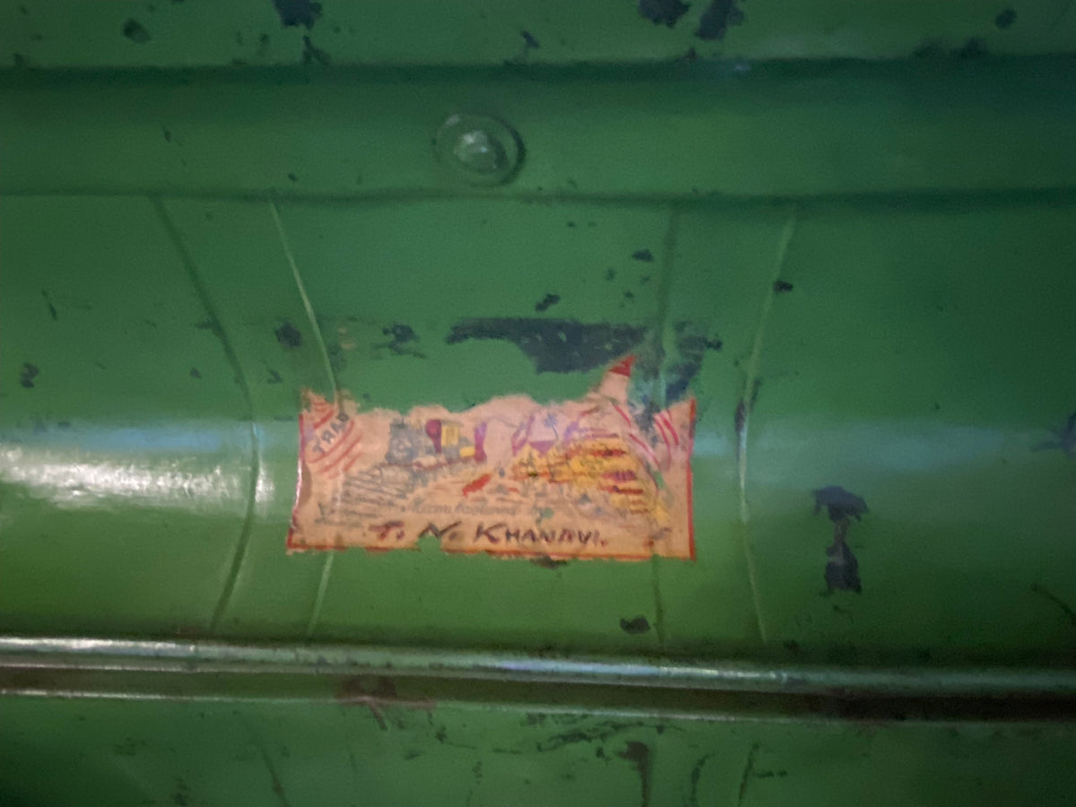 Antique metal trunk, used by surveyors during the Raj and used to protect the surveyors' instruments. This particular example is taller than most of these sorts of suitcases, and would make a lovely coffee table. Inside is the original owner's label. Height 41 cm, length 66 cm, depth 43 cm
