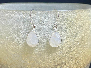 Our stunning, classic teardrop earrings feature high quality, large facet cut teardrop rainbow moonstone stones set in a simple sterling silver bezel.

Measurements: 3 cm (1.35”) length including hook&nbsp;