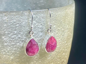 These precious emeralds and ruby stone earrings are facet cut to show off the natural liquid beauty of the stones. All finished with simple sterling silver settings to show off the beauty of the stones. Measurements: height approximately 3.5 cm including hook, depth of setting 0.5 cm