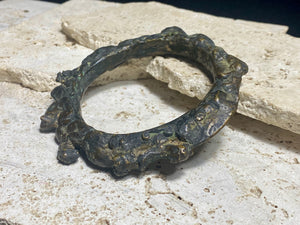 Antique Bronze Dông Son bracelet, Vietnam. Solid cast bronze bangle featuring an array of animals. Inside diameter 25 cm. Height 1.3 cm.
