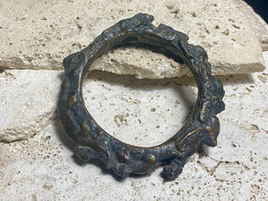 Antique Bronze Dông Son bracelet, Vietnam. Solid cast bronze bangle featuring an array of animals. Inside diameter 25 cm. Height 1.3 cm.
