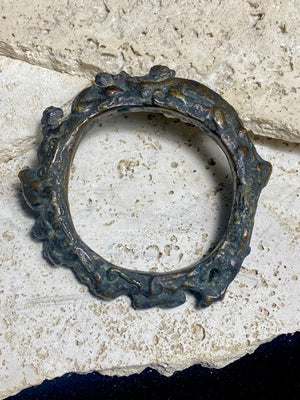 Antique Bronze Dông Son bracelet, Vietnam. Solid cast bronze bangle featuring an array of animals. Inside diameter 25 cm. Height 1.3 cm.
