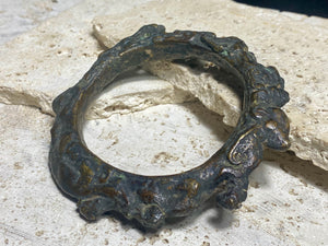 Antique Bronze Dông Son bracelet, Vietnam. Solid cast bronze bangle featuring an array of animals. Inside diameter 25 cm. Height 1.3 cm.
