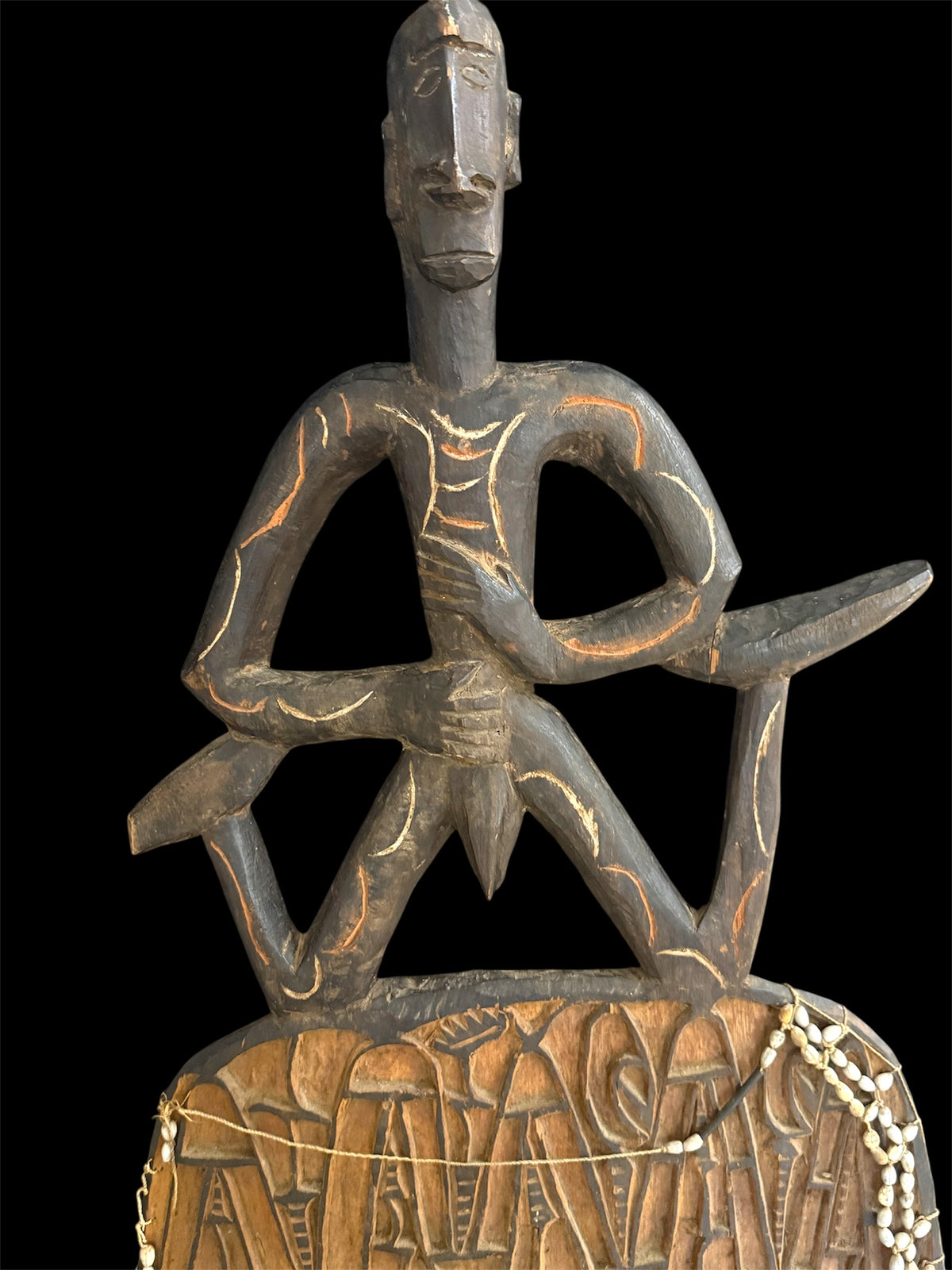 Asmat jungle hardwood shield. Wood carved and decorated with lime, ochre, charcoal, and shell beading. Central Asmat region, Irian Jaya (Indonesian Papua). Measurements: 104 cm x 39 cm, depth 17 cm