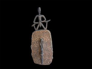 Asmat jungle hardwood shield. Wood carved and decorated with lime, ochre, charcoal, and shell beading. Central Asmat region, Irian Jaya (Indonesian Papua). Measurements: 104 cm x 39 cm, depth 17 cm