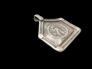 Antique Indian amulet depicting Durga in her Kali Maa form. High grade silver. Early 20th century or earlier. Height 5.3 cm including bail, width 4.5 cm