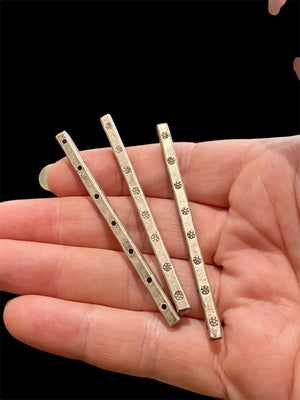 heavy silver spacer bars for jewellery making. Karen hill tribe silver, 95% pure. Seven holes for cord insertion. Length 6.7 cm, 3 x 3 cross section.