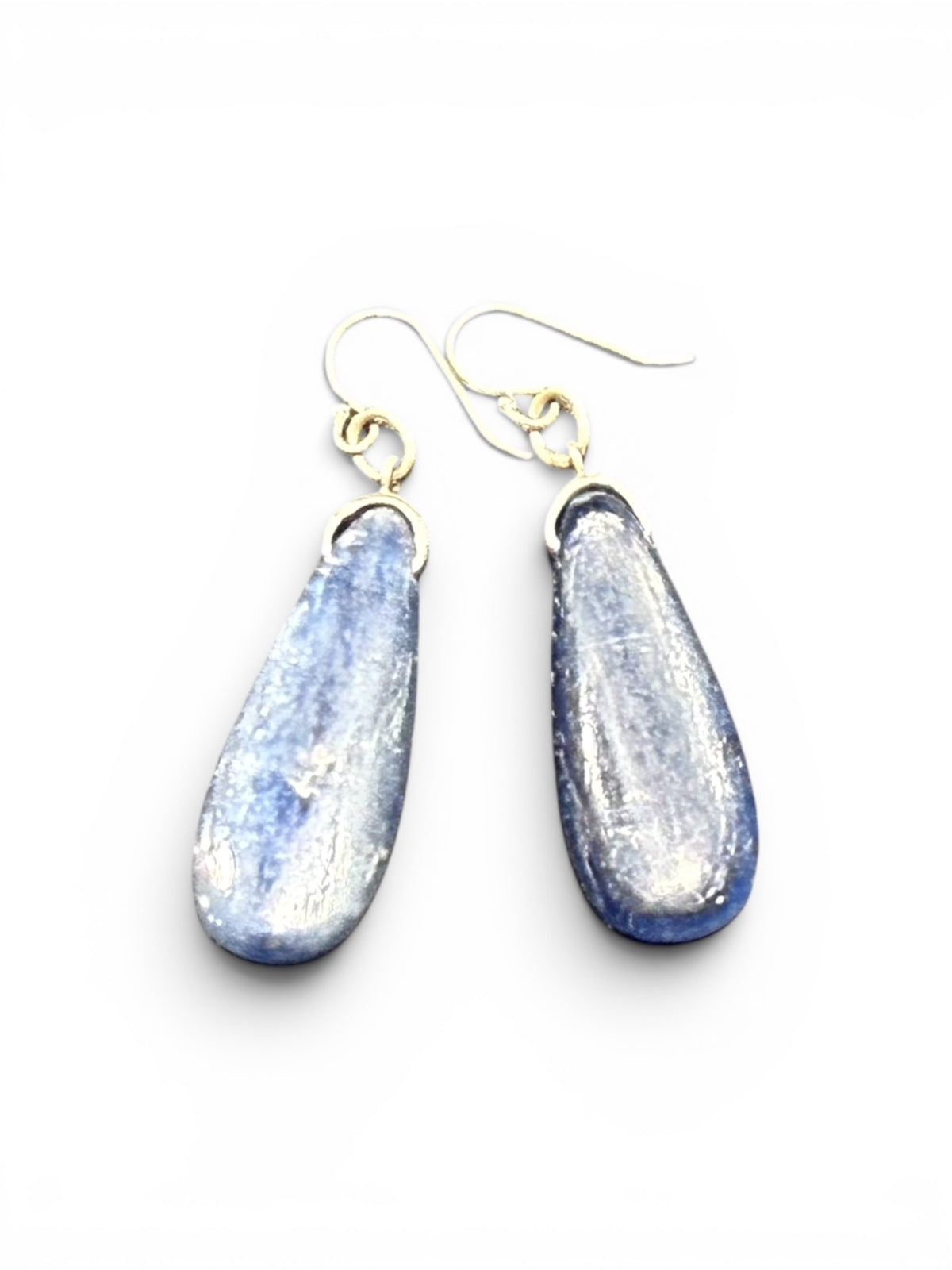 Simple kyanite earrings, featuring stones cut in a flat teardrop shape. Sterling silver hooks complete the look. Length including hook 4.5 cm
