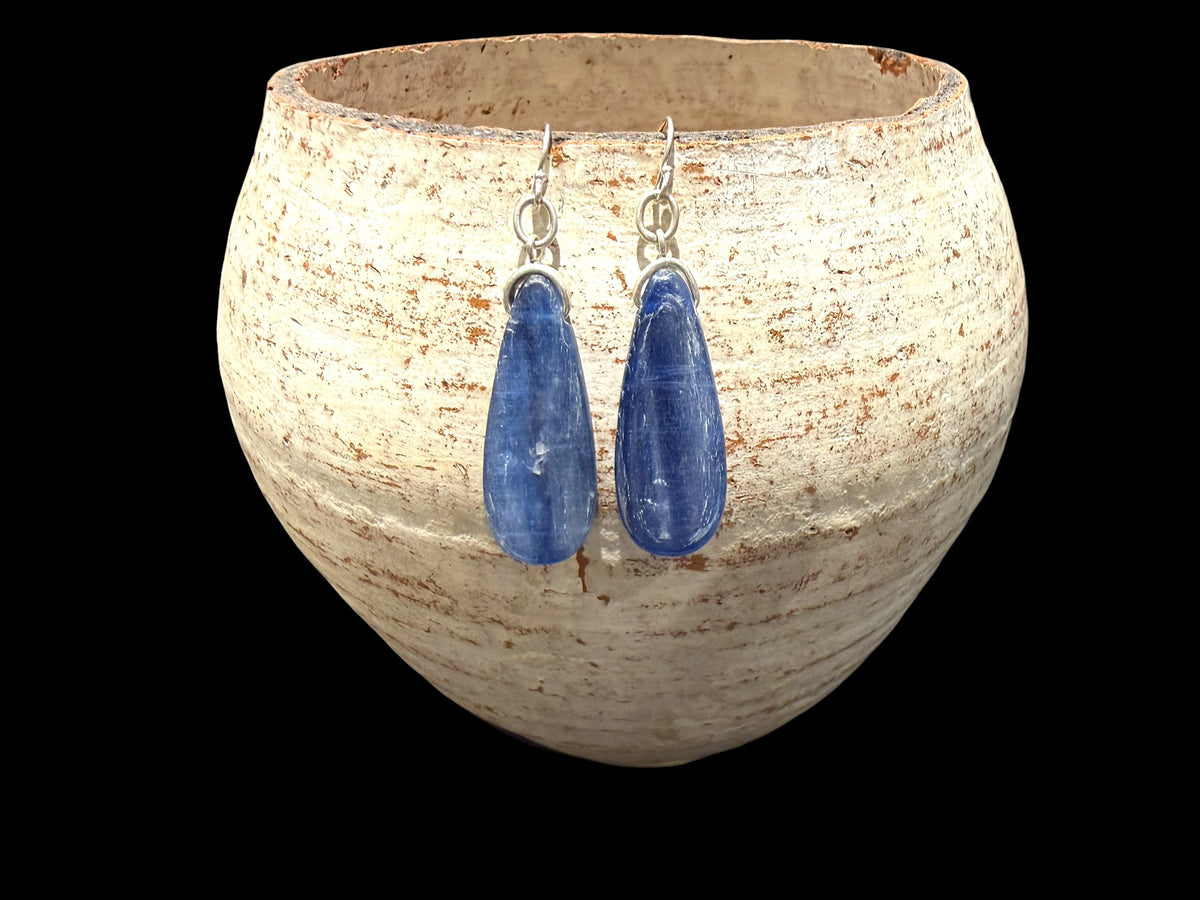 Simple kyanite earrings, featuring stones cut in a flat teardrop shape. Sterling silver hooks complete the look. Length including hook 4.5 cm