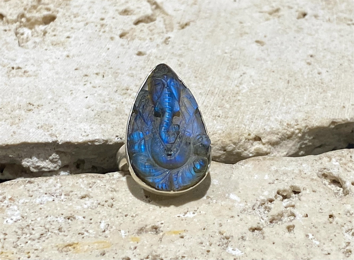 Hand carved labradorite ring with excellent fire featuring Ganesh. Sterling silver. A high quality stone with excellent colour. Stone 3 cm. Size 6.5
