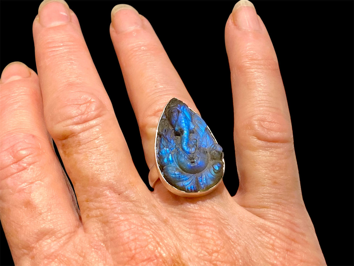 Hand carved labradorite ring with excellent fire featuring Ganesh. Sterling silver. A high quality stone with excellent colour. Stone 3 cm. Size 6.5
