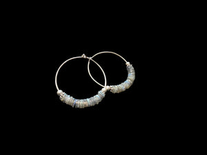 Large labradorite hoop earrings, crafted from flat labradorite stones facet cut on every side to show off their lustre. Sterling silver hoops. 5 cm diameter