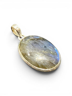 Large flat oval clear labradorite pendant set in sterling silver with a generous bail to take a large chain or cord. Length including bail 4.3 cm, width 2.3 cm