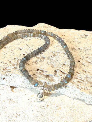 Faceted labradorite rondels, sterling silver detailing and a solid silver pendant, sterling silver hook clasp. Length: 44 cm