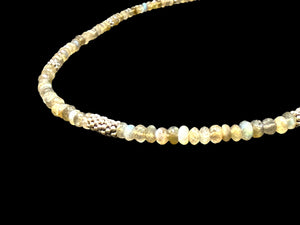 A lovely short necklace of faceted labradorite rondels highlighted with sterling silver and finished with a sterling silver hook clasp, length 46.5 cm
