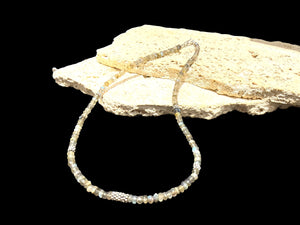 A lovely short necklace of faceted labradorite rondels highlighted with sterling silver and finished with a sterling silver hook clasp, length 46.5 cm