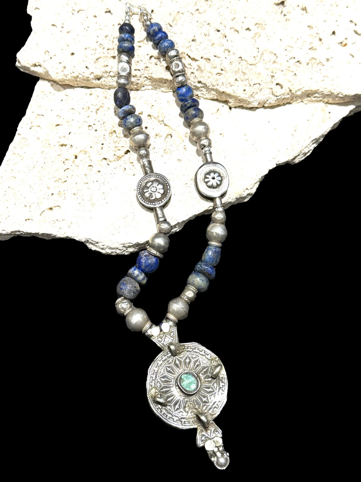 Unique statement necklace crafted from antique Afghani lapis, Indian tribal beads, old silver Uzbeki beads & an antique Tibetan centrepiece. Length 46.3 cm