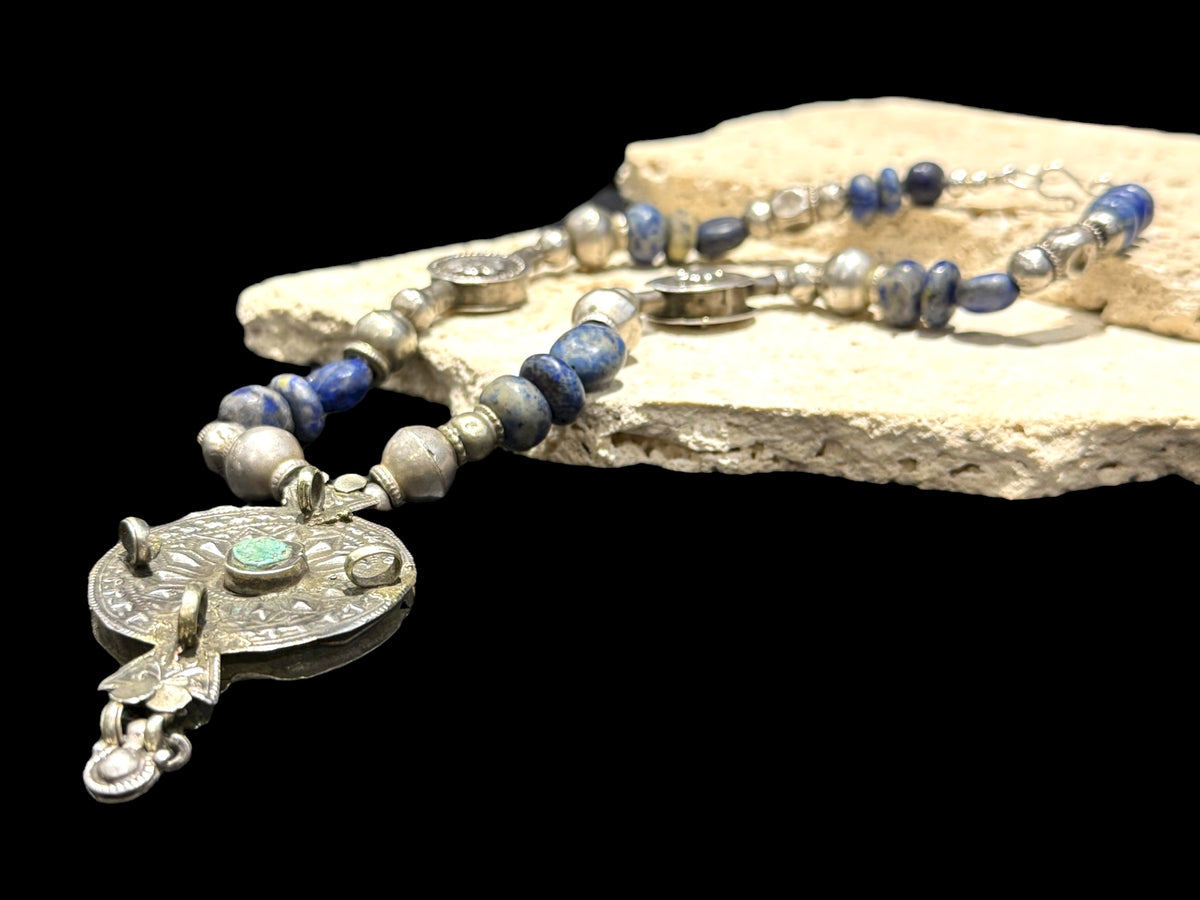 Unique statement necklace crafted from antique Afghani lapis, Indian tribal beads, old silver Uzbeki beads & an antique Tibetan centrepiece. Length 46.3 cm