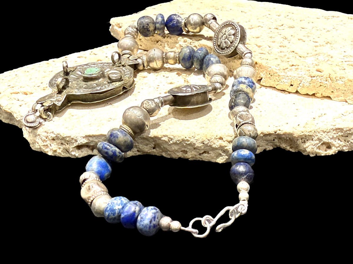 Unique statement necklace crafted from antique Afghani lapis, Indian tribal beads, old silver Uzbeki beads & an antique Tibetan centrepiece. Length 46.3 cm