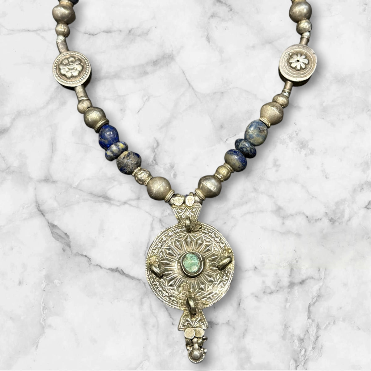 Unique statement necklace crafted from antique Afghani lapis, Indian tribal beads, old silver Uzbeki beads & an antique Tibetan centrepiece. Length 46.3 cm