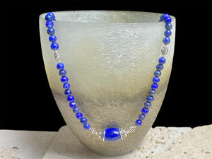 Simple and elegant, our medium length necklace is made from deep blue Afghan lapis lazuli and sterling silver, with a sterling silver clasp. Length 48 cm (19")