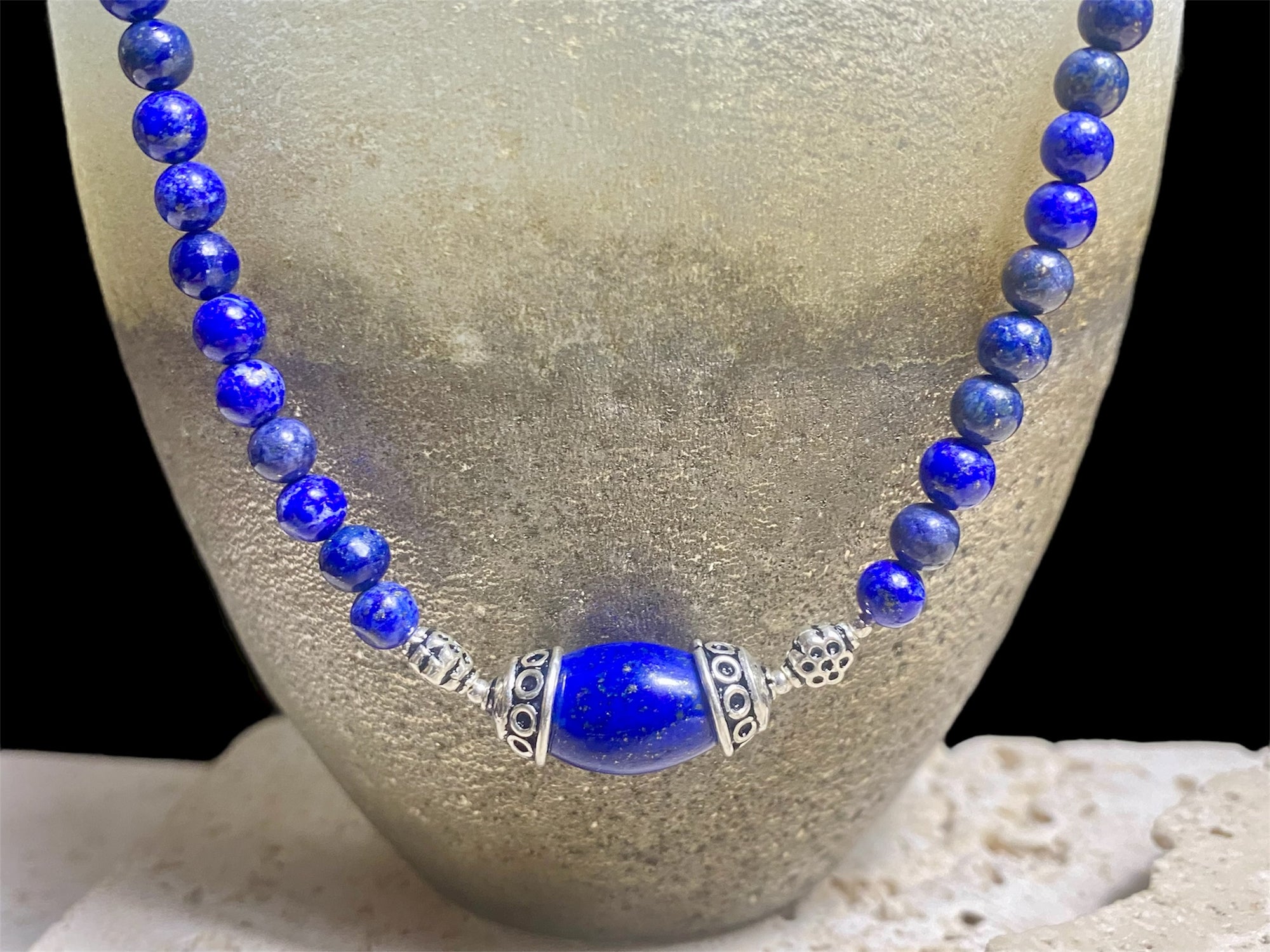 Simple and elegant, our medium length necklace is made from deep blue Afghan lapis lazuli and sterling silver, with a sterling silver clasp. Length 48 cm (19")