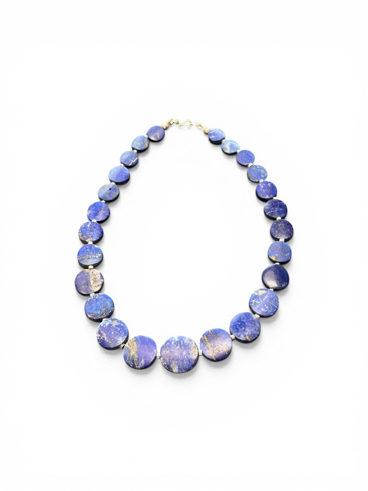 Natural lapis lazuli flat disk beads, colour matched and graduated, with sterling silver spacer beads and a sterling silver clasp. Length 43 cm