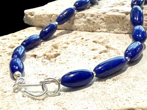 Simple and elegant, this longer length necklace is made from deep blue, AAA grade Afghan lapis lazuli and sterling silver beads, finished with sterling silver findings. Measurements: Length 48 cm (19")