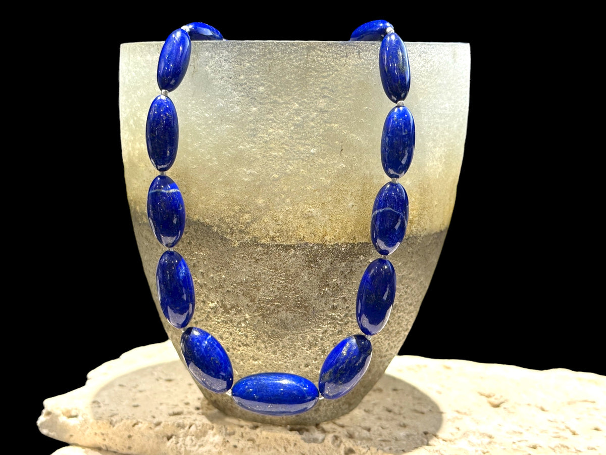 Simple and elegant, this longer length necklace is made from deep blue, AAA grade Afghan lapis lazuli and sterling silver beads, finished with sterling silver findings. Measurements: Length 48 cm (19")