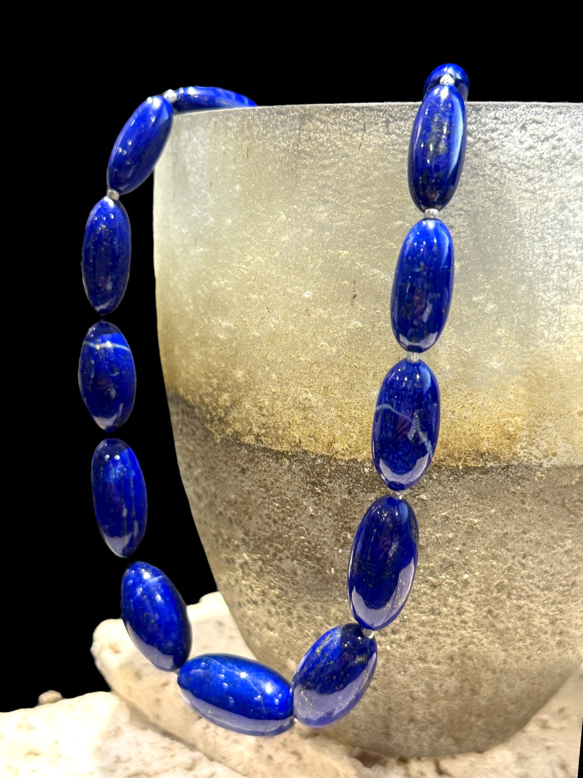 Simple and elegant, this longer length necklace is made from deep blue, AAA grade Afghan lapis lazuli and sterling silver beads, finished with sterling silver findings. Measurements: Length 48 cm (19")
