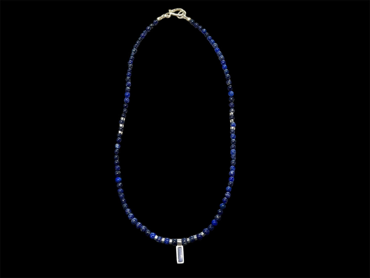 Afghan lapis lazuli with a silver and lapis pendant, highlighted with bright sterling silver beads, finished with a sterling silver hook clasp. Length 41 cm (16.2")