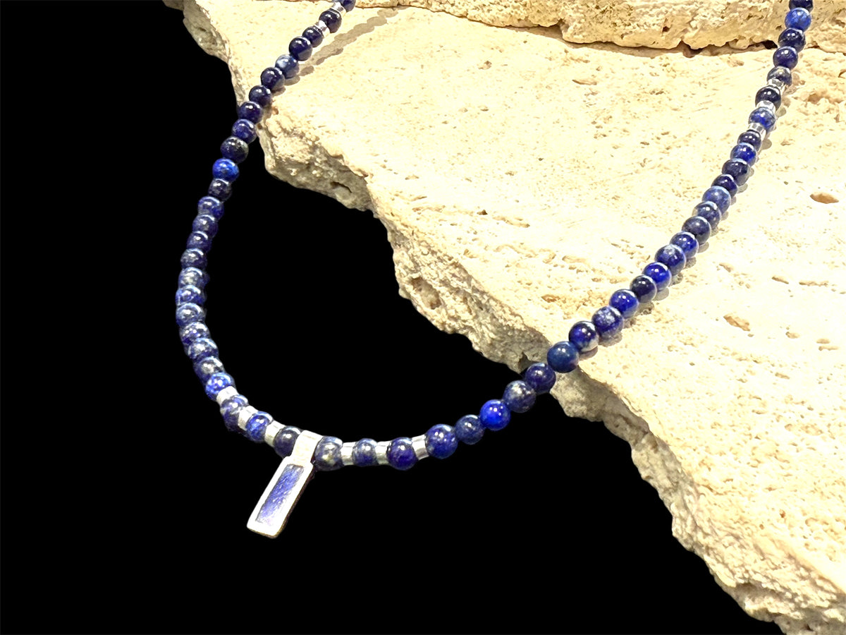 Afghan lapis lazuli with a silver and lapis pendant, highlighted with bright sterling silver beads, finished with a sterling silver hook clasp. Length 41 cm (16.2")