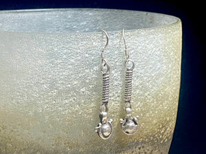 The silver that makes up these tribal earrings are a combination of high grade silver antique beads sourced by us many years in Pakistan and India. They feature 925 sterling silver hooks and are light and easy to wear. They will appeal to anyone with a taste for the beautiful and unusual. Measurements: 4.7 cm length including hook