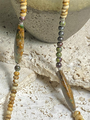 A unique necklace featuring bloodstone,  jasper, Baltic amber and antique amber prayer beads. Highlighted with sterling silver beads and ends. Length 69 cm
