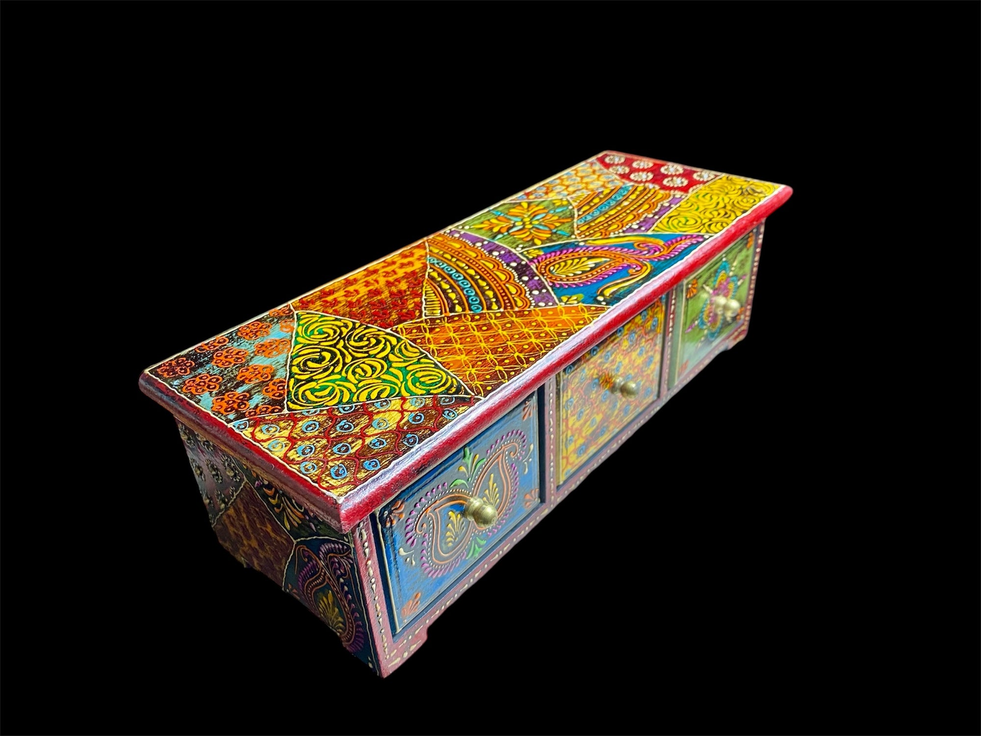 This intricately painted box features three spacious drawers, small feet and brass knobs as handles. The roominess of the drawers means our long, low chest is perfect for holding everything from trinkets to jewellery and essential oils. Width 34.5, depth 13 cm, height 10.5 cm