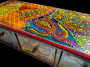 This intricately painted box features three spacious drawers, small feet and brass knobs as handles. The roominess of the drawers means our long, low chest is perfect for holding everything from trinkets to jewellery and essential oils. Width 34.5, depth 13 cm, height 10.5 cm