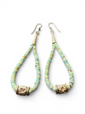 Natural, matte Arizona turquoise is teamed with antique tribal silver beads. The earrings are finished with sterling silver. Measurements: length 10.8 cm