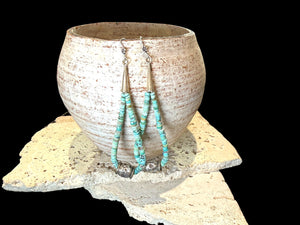 Natural, matte Arizona turquoise is teamed with antique tribal silver beads. The earrings are finished with sterling silver. Measurements: length 10.8 cm