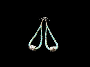 Natural, matte Arizona turquoise is teamed with antique tribal silver beads. The earrings are finished with sterling silver. Measurements: length 10.8 cm
