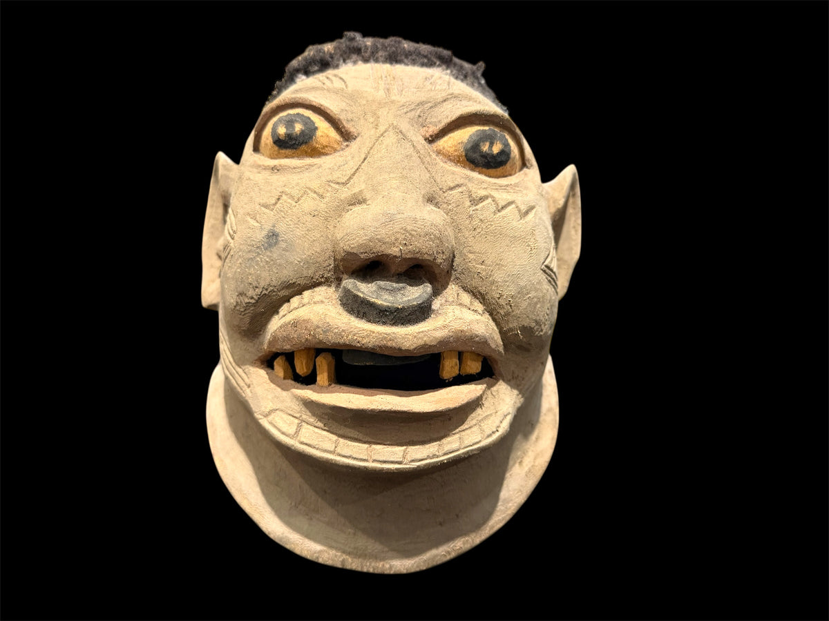 Makonde helmet mask. Balsa wood, human hair and pigment. Moda, Mozambique. Circa mid 90's. Worn in dances that conclude the initiation ceremonies for adolescent boys and girls. Measurements: length 24 cm, width 20 cm, height 22 cm