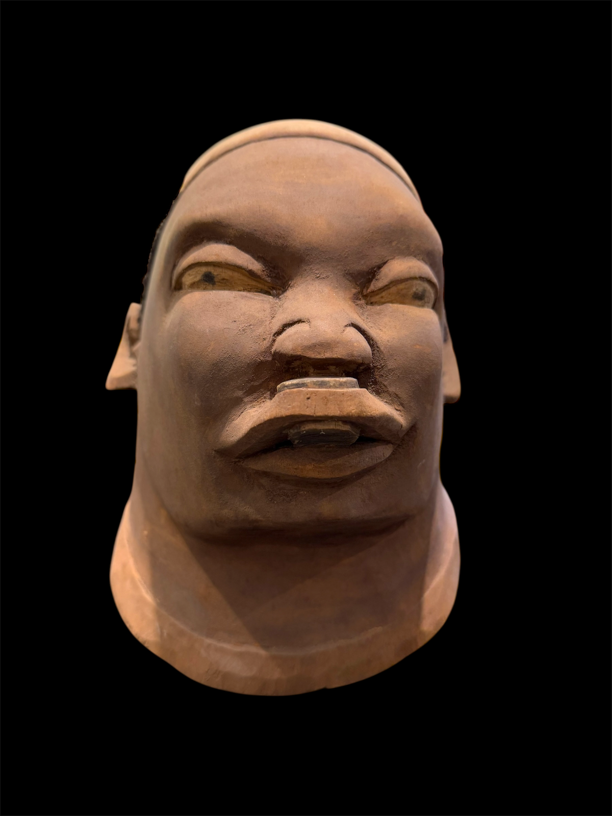 Makonde helmet mask. Balsa wood, human hair and pigment. Moda, Mozambique, Circa mid 90's. Worn in dances that conclude the initiation ceremonies for adolescent boys and girls. Measurements: length 25 cm, width 19 cm, height 20 cm