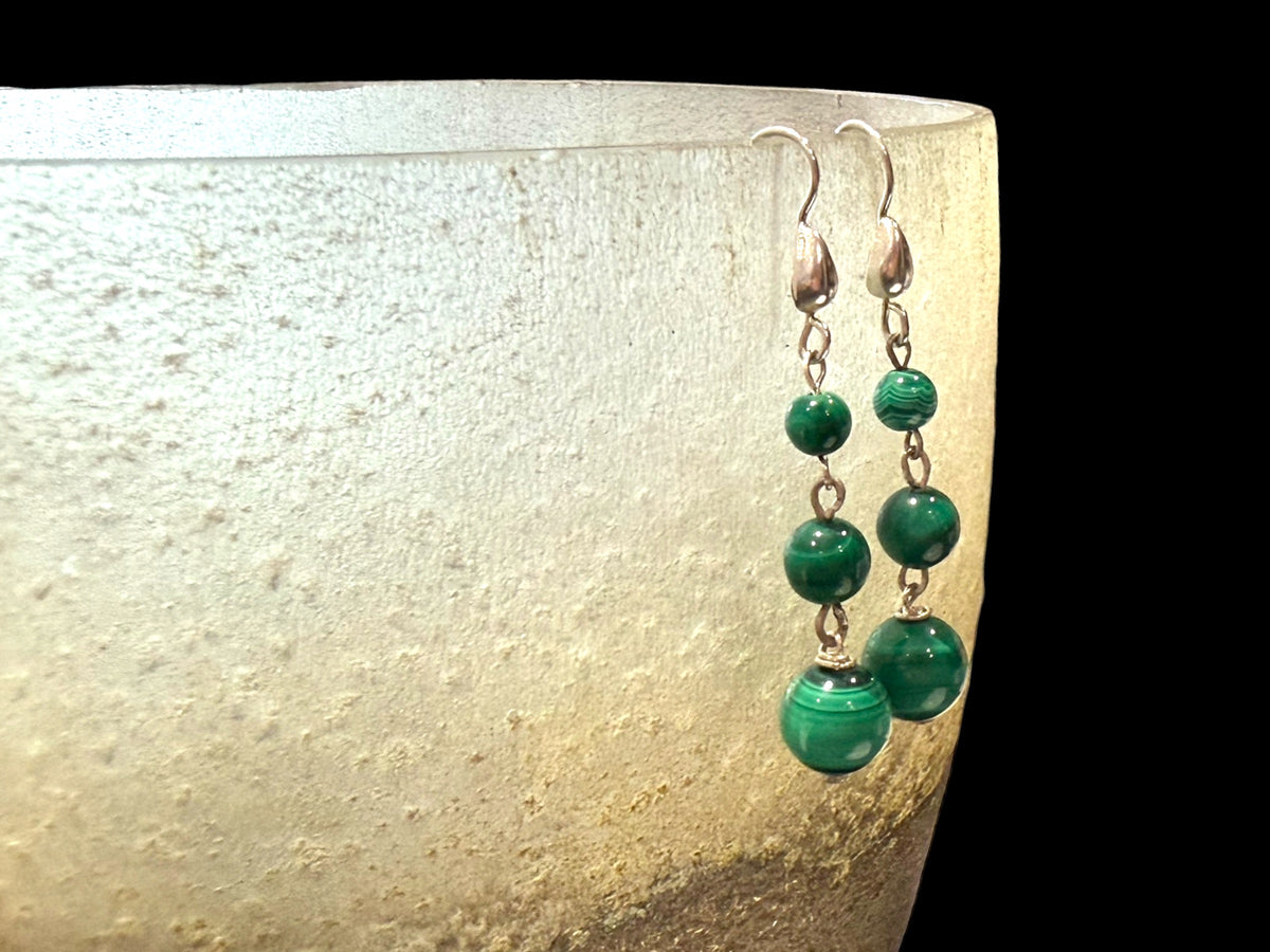 Malachite ball earrings. Finished with elegant sterling silver hooks and detailing. Length 4.7 cm including hook, largest bead 8 mm diameter