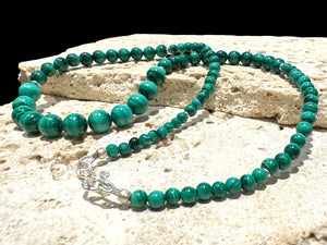 Graduated round malachite beads are highlighted with the smallest amount of sterling silver detailing and a sturdy hook clasp. Measurements: 47.2 cm length. Bead diameter 8mm, 6mm, 4mm and 3mm