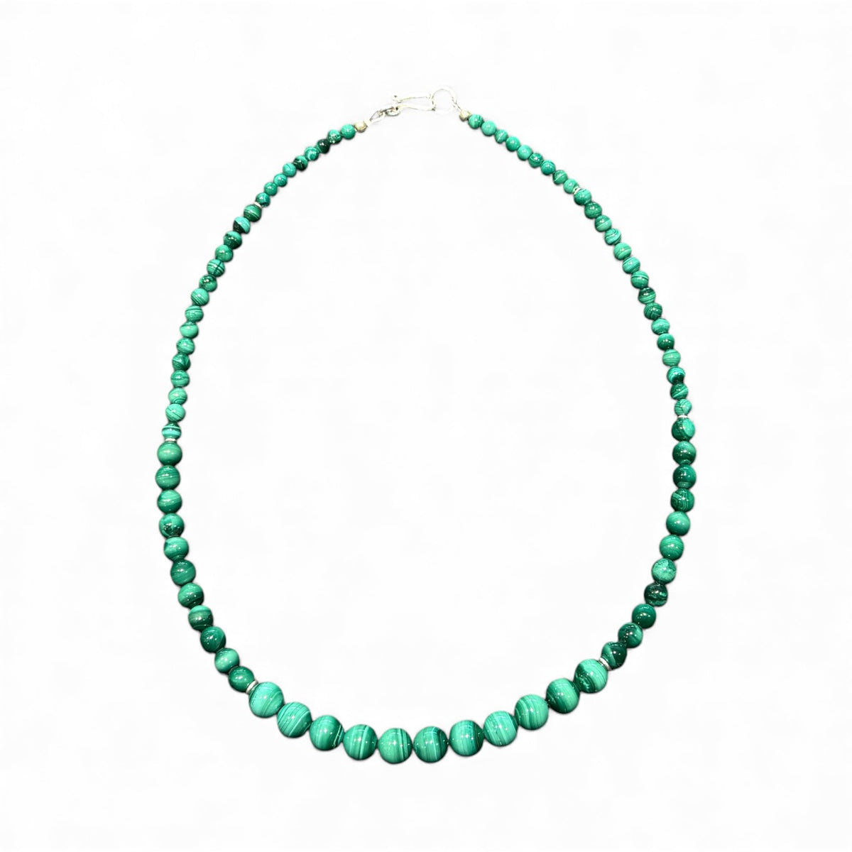 Graduated round malachite beads are highlighted with the smallest amount of sterling silver detailing and a sturdy hook clasp. Measurements: 47.2 cm length. Bead diameter 8mm, 6mm, 4mm and 3mm